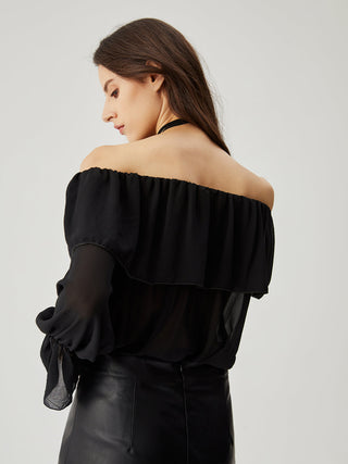 Blouse à épaules dénudées en mousseline semi-transparente avec volants