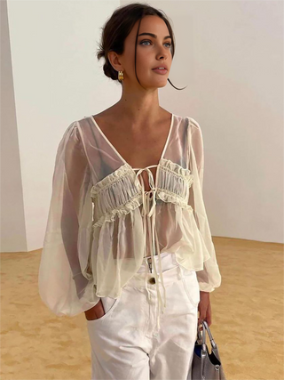 Blouse transparente à manches longues avec cordon de serrage