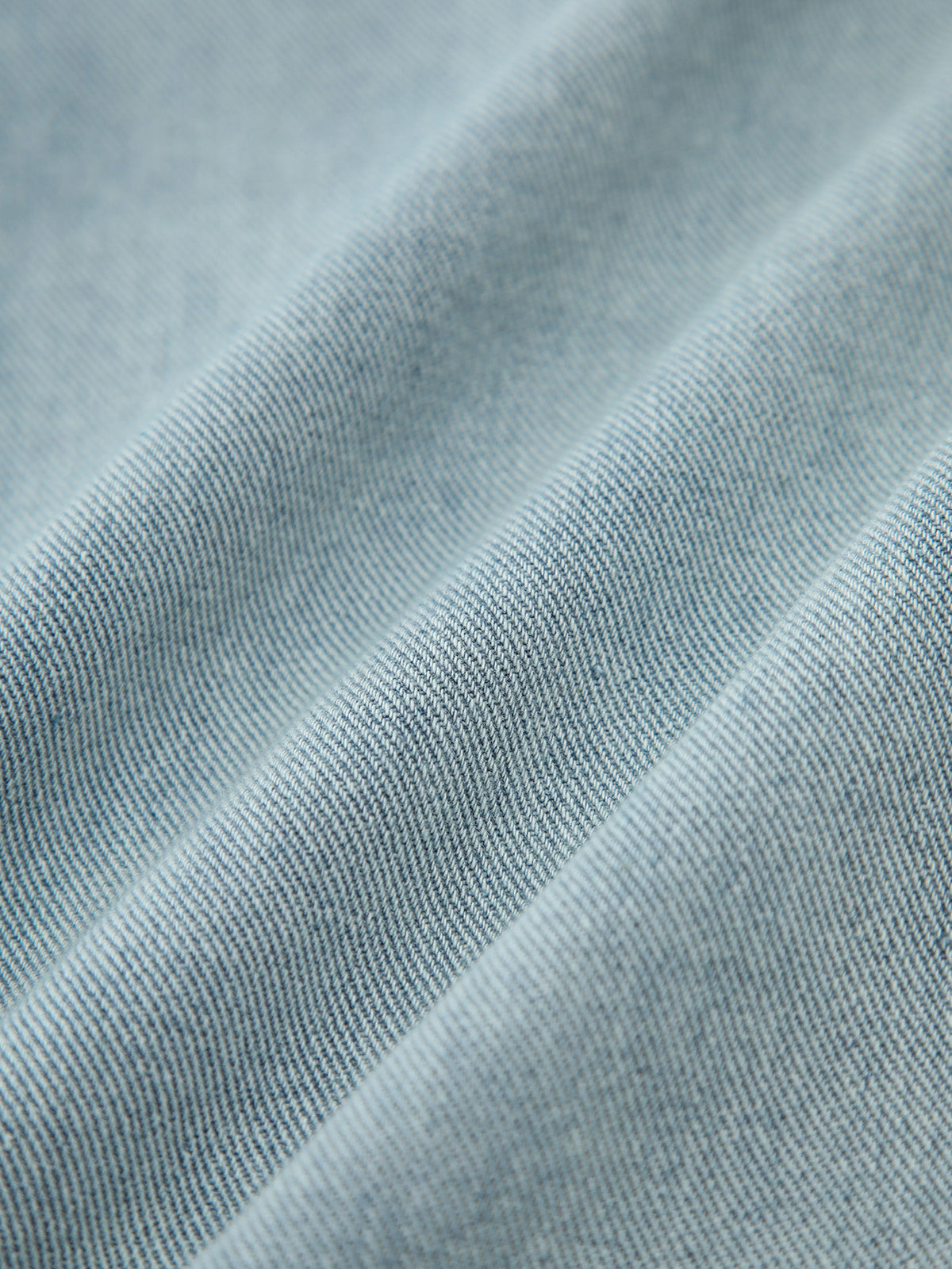 Jean en denim vintage à ourlet brut asymétrique