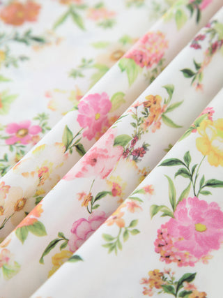 Robe longue plissée à motif floral avec nœud