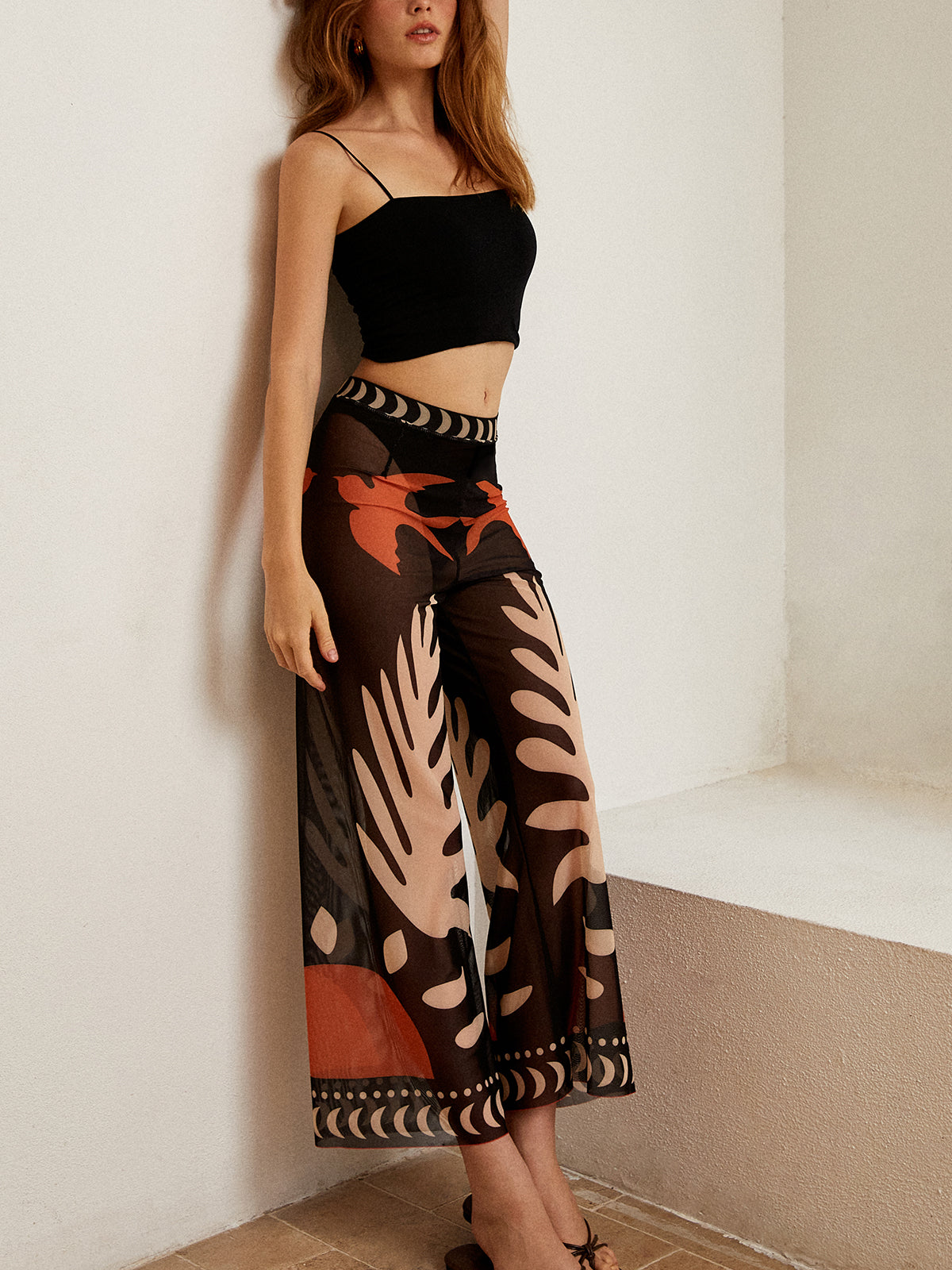 Pantalon en maille transparente imprimé d'oiseaux