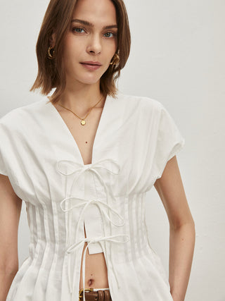 Blouse plissée en coton nouée