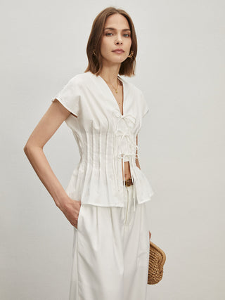 Blouse plissée en coton nouée