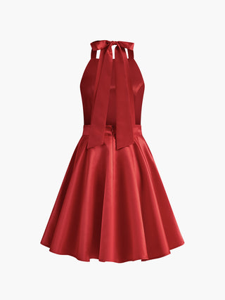 Robe mini plissée à dos ouvert avec poches doubles nouées en satin